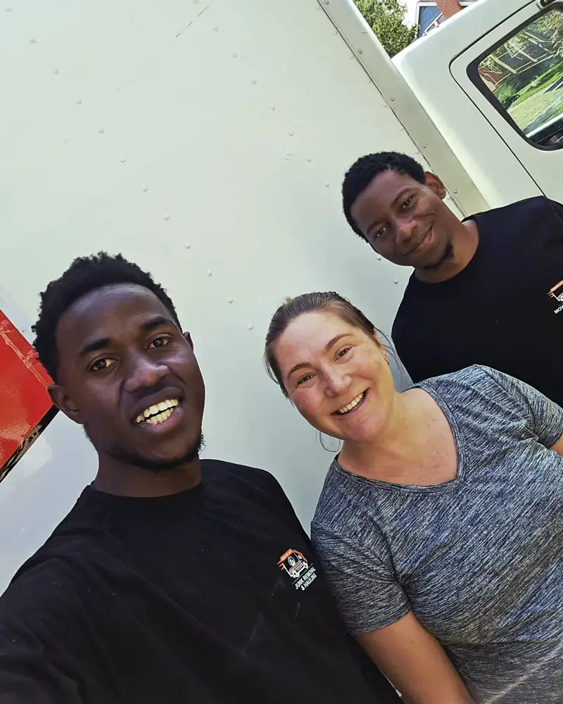 Breath Out crew with a customer beside the truck after a move